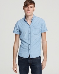 Rendered in organic cotton chambray, this cool button-down from Nudie Jeans Co offers mellow styling for outdoor dinners and chilling downtown. Rendered in organic cotton chambray, this cool button-down from Nudie Jeans Co offers mellow styling for outdoor dinners and chilling downtown.