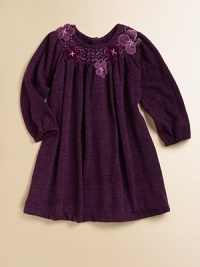 An ultra-soft, rich-colored knit with a smocked neckline and delicate flowers. ScoopneckSmocked necklineLong sleeves with elastic cuffsA-lineButton back92% polyester/8% spandexHand wash or dry cleanImported An ultra-soft, rich-colored knit with a smocked neckline and delicate flowers. ScoopneckSmocked necklineLong sleeves with elastic cuffsA-lineButton back92% polyester/8% spandexHand wash or dry cleanImported