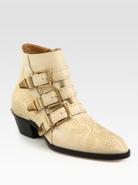 Metal studs coat this leather ankle boot for a tough-luxe effect, finished with adjustable buckle straps and a stacked heel. Stacked heel, 2 (50mm)Leather upper with metal studsSide zip and adjustable buckle strapsLeather lining and solePadded insoleMade in Italy Metal studs coat this leather ankle boot for a tough-luxe effect, finished with adjustable buckle straps and a stacked heel. Stacked heel, 2 (50mm)Leather upper with metal studsSide zip and adjustable buckle strapsLeather lining and solePadded insoleMade in Italy