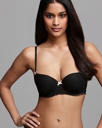 A push-up balconette bra with soft ruffle tulle trim and contrast bow accents, a sweet style from Cosabella. Style #CANDY1106 A push-up balconette bra with soft ruffle tulle trim and contrast bow accents, a sweet style from Cosabella. Style #CANDY1106