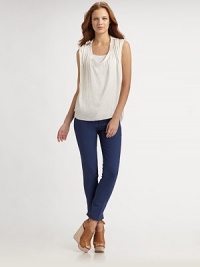 Ruched, glossy v-neck with a unique point collar and chic hi-low hem. Point collarRuched v-neckSleevelessHi-low hemPolyesterDry cleanImportedOUR FIT MODEL RECOMMENDS ordering true size. Ruched, glossy v-neck with a unique point collar and chic hi-low hem. Point collarRuched v-neckSleevelessHi-low hemPolyesterDry cleanImportedOUR FIT MODEL RECOMMENDS ordering true size.