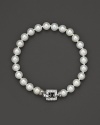 A cultured, freshwater pearl bracelet with a square, diamond clasp.