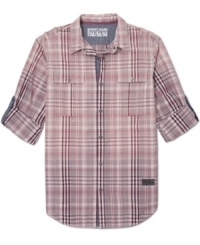 DKNY Jeans takes the plaid shirt out of the great outdoors, adding an urban spin with sleeve tabs and an inner placket in a contrasting fabric. DKNY Jeans takes the plaid shirt out of the great outdoors, adding an urban spin with sleeve tabs and an inner placket in a contrasting fabric.