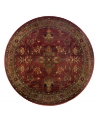 A truly charming interpretation of a traditional carpet, this round rug features a center medallion ringed by palmettes and floral details in sage green, topaz and slate blue against a rich burgundy ground. Striated effects create the weathered look of handmade rugs in a stain-resistant, no-shed manmade fiber. A truly charming interpretation of a traditional carpet, this round rug features a center medallion ringed by palmettes and floral details in sage green, topaz and slate blue against a rich burgundy ground. Striated effects create the weathered look of handmade rugs in a stain-resistant, no-shed manmade fiber.