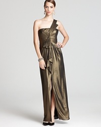 In fluid, shimmering fabric, this BCBGMAXAZRIA gown lends statement style in a spotlight-ready one shoulder silhouette. Pair with vintage-inspired jewelry to complete the look. In fluid, shimmering fabric, this BCBGMAXAZRIA gown lends statement style in a spotlight-ready one shoulder silhouette. Pair with vintage-inspired jewelry to complete the look.