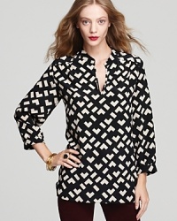 Fashion's most celebrated color duo mix it up on this striking silk Amanda Uprichard shirt in a unique chevron print. Fashion's most celebrated color duo mix it up on this striking silk Amanda Uprichard shirt in a unique chevron print.