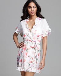 A floral print short sleeve wrapper with ruffle trim for a pretty bedtime look. A floral print short sleeve wrapper with ruffle trim for a pretty bedtime look.
