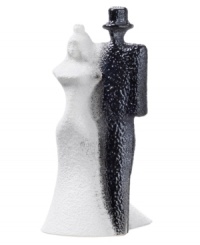 Bride and groom look equally stunning in this Kosta Boda sculpture, strutting down the aisle in handcrafted glass. A textured surface is created with heated glass powder for added interest and that unmistakable wedding day glow. Designed by Kjell Engman. Bride and groom look equally stunning in this Kosta Boda sculpture, strutting down the aisle in handcrafted glass. A textured surface is created with heated glass powder for added interest and that unmistakable wedding day glow. Designed by Kjell Engman.