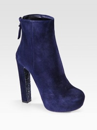 This ankle boot design features a glitter sole and hidden platform. Glitter and suede heel, 5¼ (130mm)Hidden platform, 1½ (40mm)Compares to a 3¾ heel (95mm)Suede upperBack zipGlitter soleLeather lining and solePadded insoleMade in Italy This ankle boot design features a glitter sole and hidden platform. Glitter and suede heel, 5¼ (130mm)Hidden platform, 1½ (40mm)Compares to a 3¾ heel (95mm)Suede upperBack zipGlitter soleLeather lining and solePadded insoleMade in Italy