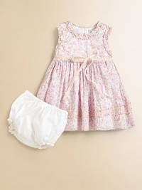 A pretty Liberty Print from England has ruffles and ribbons in this adorable cotton frock.Round ruffled necklineSleevelessEmpire waist with velvet ribbon tiesBack buttonsFull skirt with ruffle and ribbon near hemSolid bloomers with elasticized waist and leg openingsCotton liningCottonDry cleanImported Please note: Number of buttons may vary depending on size ordered. A pretty Liberty Print from England has ruffles and ribbons in this adorable cotton frock.Round ruffled necklineSleevelessEmpire waist with velvet ribbon tiesBack buttonsFull skirt with ruffle and ribbon near hemSolid bloomers with elasticized waist and leg openingsCotton liningCottonDry cleanImported Please note: Number of buttons may vary depending on size ordered.