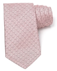 A textural pattern tie in an understated color resolves your workday attire with simple refinement. A textural pattern tie in an understated color resolves your workday attire with simple refinement.