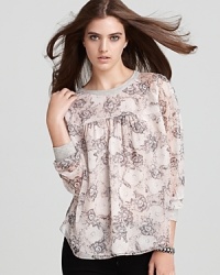 An elegant Rebecca Taylor blouse enlivened by an artistically-illustrated floral print in a relaxed, loose-fitting shape. An elegant Rebecca Taylor blouse enlivened by an artistically-illustrated floral print in a relaxed, loose-fitting shape.