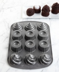 Make the most of the middle. Everyone's favorite treat gets even tastier with a cream-, frosting- or fruit- filled center that takes this dessert to a whole new level... and height! The heavy cast-aluminum pan with nonstick coating heats up fast and cleans up quick for deliciously delightful treats that put a new spin on the cupcake craze. 10-year warranty. Make the most of the middle. Everyone's favorite treat gets even tastier with a cream-, frosting- or fruit- filled center that takes this dessert to a whole new level... and height! The heavy cast-aluminum pan with nonstick coating heats up fast and cleans up quick for deliciously delightful treats that put a new spin on the cupcake craze. 10-year warranty.