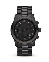This sleek all-black timepiece from MICHAEL Michael Kors exudes up-to-the-minute style. This sleek all-black timepiece from MICHAEL Michael Kors exudes up-to-the-minute style.
