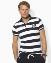 Bold stripes and heritage embroidery lend masculine polish to a trim-fitting rugby shirt in breathable cotton mesh. Bold stripes and heritage embroidery lend masculine polish to a trim-fitting rugby shirt in breathable cotton mesh.