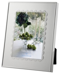 A delicate lace-inspired pattern trims sleek silver plate, giving Vera Wang's Flirt picture frame a sense of timeless grace and femininity. A delicate lace-inspired pattern trims sleek silver plate, giving Vera Wang's Flirt picture frame a sense of timeless grace and femininity.