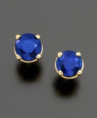 A round-cut sapphire (1 ct. t.w.) cradled in polished 14k gold 4-prong setting. A round-cut sapphire (1 ct. t.w.) cradled in polished 14k gold 4-prong setting.