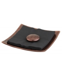 A sophisticated way to offer napkins to your guests. Crafted of alloy and finished in beautiful bronze, this Heritage pebble napkin holder serving set from Nambe's collection of serveware combines old-world elegance with a chic, modern shape. A sophisticated way to offer napkins to your guests. Crafted of alloy and finished in beautiful bronze, this Heritage pebble napkin holder serving set from Nambe's collection of serveware combines old-world elegance with a chic, modern shape.