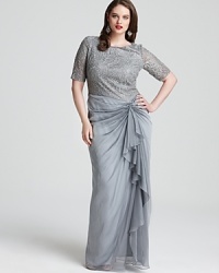 An ornately embroidered and sequined bodice crowns a cascading skirt on this Tadashi Shoji gown -- a stunning example of sophisticated glamour. An ornately embroidered and sequined bodice crowns a cascading skirt on this Tadashi Shoji gown -- a stunning example of sophisticated glamour.