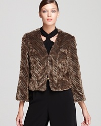 Obey your animal instincts with this plush faux fur Trina Turk jacket, simply structured in a modern cropped silhouette. Obey your animal instincts with this plush faux fur Trina Turk jacket, simply structured in a modern cropped silhouette.