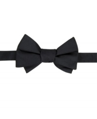 Add some top of the line polish to any sophisticated combination and pair this Tommy Hilfiger bow tie with your best black suits. Add some top of the line polish to any sophisticated combination and pair this Tommy Hilfiger bow tie with your best black suits.