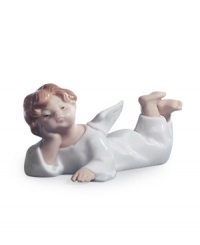 Rest easy with an angel watching over your home. Just precious in glazed porcelain, this winged cherub looks perfectly in place on a dresser, shelf or mantel. From Lladro. Rest easy with an angel watching over your home. Just precious in glazed porcelain, this winged cherub looks perfectly in place on a dresser, shelf or mantel. From Lladro.