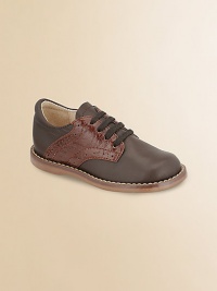 Traditionally constructed in the smoothest leather, this classic look comes with distressed contrast leather trim at the sides.Leather upper Lace-up closure Rubber sole Padded insole Leather lining ImportedPlease note: It is recommended that you order ½ size smaller than measured. If your child measures a size 7.0, you may want to order a 6½. 
