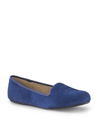 Slip into the smoking flat trend in these cozy, shearling-lined UGG® Australia slippers. Piping lends them a classically elegant touch. Slip into the smoking flat trend in these cozy, shearling-lined UGG® Australia slippers. Piping lends them a classically elegant touch.