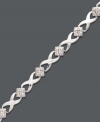 Seal the deal with a sweet kiss. Victoria Townsend's tasteful tennis bracelet features a cut-out X link design with sparkling diamond accents. Crafted in sterling silver. Approximate length: 7-1/4 inches.