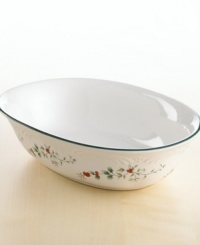 This spirited serving bowl is a festive and functional addition to the timeless Winterberry pattern. Holly leaves and bright red berries are accented with raised details and a green rim. From Pfaltzgraff's collection of dinnerware and dishes. This spirited serving bowl is a festive and functional addition to the timeless Winterberry pattern. Holly leaves and bright red berries are accented with raised details and a green rim. From Pfaltzgraff's collection of dinnerware and dishes.