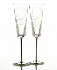 Enjoy a crisp toast with this delightfully elegant pair of champagne flutes. In clear crystal, this set features the finely cut ribbon motif of the Belle Boulevard collection. Enjoy a crisp toast with this delightfully elegant pair of champagne flutes. In clear crystal, this set features the finely cut ribbon motif of the Belle Boulevard collection.
