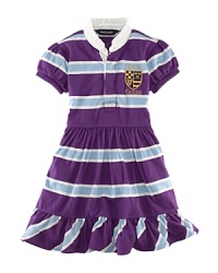The classic striped rugby shirt inspired a comfortable cotton jersey dress, finished for a pretty look with a ruffled collar and puff sleeves. The classic striped rugby shirt inspired a comfortable cotton jersey dress, finished for a pretty look with a ruffled collar and puff sleeves.