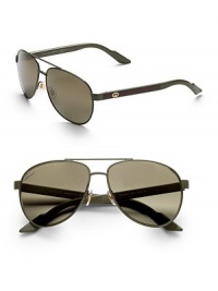 Lightweight metal frames with web stripe logo detail at temple. Available in palm green with grey gradient lens, blue white with smoke mirror gradient lens and shiny black/brown tortoise with grey gradient lens.100% UV protectionMade in Italy Lightweight metal frames with web stripe logo detail at temple. Available in palm green with grey gradient lens, blue white with smoke mirror gradient lens and shiny black/brown tortoise with grey gradient lens.100% UV protectionMade in Italy