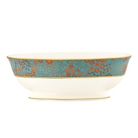 The luxurious, museum-quality floral motifs in Gilded Tapestry create a dramatic presentation sure to command attention at any dinner party. Warm ember hues and golden tones are offset by cool blue accents on this compelling pattern. Unique layering of of each place setting piece atop the other highlights the common threads of color and metallics while creating a sophisticated style.