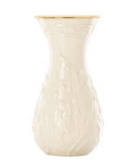 Lily of the valley springs from ivory porcelain, giving this Lenox Floral Meadow vase a delightfully understated grace. A band of sumptuous gold adds to its classic allure. Lily of the valley springs from ivory porcelain, giving this Lenox Floral Meadow vase a delightfully understated grace. A band of sumptuous gold adds to its classic allure.