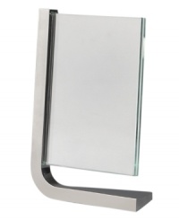 Cast your friends and family members in this modern Movie frame. One rounded corner forged in gleaming Nambé alloy suspends plates of glass -- and your photo -- in a vertical direction. Designed by Neil Cohen. Cast your friends and family members in this modern Movie frame. One rounded corner forged in gleaming Nambé alloy suspends plates of glass -- and your photo -- in a vertical direction. Designed by Neil Cohen.