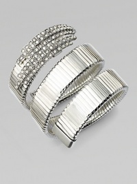 An alluring ribbed snake coils around the wrist, capped by dazzling Swarovski crystals at one end.CrystalSilverplatedDiameter, about 2¼Width, about 2¾Made in Italy An alluring ribbed snake coils around the wrist, capped by dazzling Swarovski crystals at one end.CrystalSilverplatedDiameter, about 2¼Width, about 2¾Made in Italy
