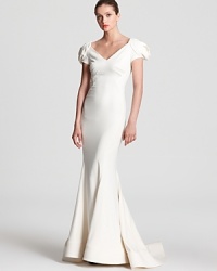 Capture every eye in the room in this stunning Zac Posen gown, cut in a body-skimming silhouette with pleats at the lower skirt and a flared, fishtail hem. A statement necklace and towering heels are the hallmarks that complete this standout look for breathtaking finish. Capture every eye in the room in this stunning Zac Posen gown, cut in a body-skimming silhouette with pleats at the lower skirt and a flared, fishtail hem. A statement necklace and towering heels are the hallmarks that complete this standout look for breathtaking finish.
