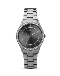 Swarovski crystals around the polished steel case add a touch of glitz to this classic link band watch from Skagen. Swarovski crystals around the polished steel case add a touch of glitz to this classic link band watch from Skagen.
