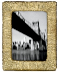 Set a scene with the rich texture and tone of Wrap picture frames, featuring the look of fine silken threads and the shine of plated brass. A luxe wooden back adds an elegant touch to the Donna Karan Lenox design. Set a scene with the rich texture and tone of Wrap picture frames, featuring the look of fine silken threads and the shine of plated brass. A luxe wooden back adds an elegant touch to the Donna Karan Lenox design.