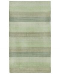 Hand-tufted, blended wool gives an exceptionally soft feel to this rug from the Coastal Treasures collection. In a shimmering, striped design of moss-green colorways, this sophisticated piece adds serene character to every decor. Hand-tufted, blended wool gives an exceptionally soft feel to this rug from the Coastal Treasures collection. In a shimmering, striped design of moss-green colorways, this sophisticated piece adds serene character to every decor.