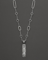 John Hardy's tribal-influenced station necklace features rectangle and circle stations and a carved pendant at the base. John Hardy's tribal-influenced station necklace features rectangle and circle stations and a carved pendant at the base.