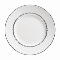 Vera Wang introduces Flirt fine bone china dinnerware. This platinum banded pattern features a modern scallop lace motif and a contemporary take on traditional lace work. Decoration on the inner verge of the accent plate, bread and butter and tea saucer adds a flirtatious touch of whimsy.