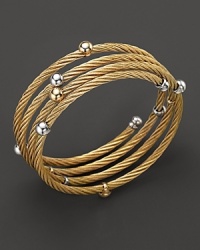 Gleaming beads dot this 18K yellow gold and stainless steel wrap bracelet. Gleaming beads dot this 18K yellow gold and stainless steel wrap bracelet.