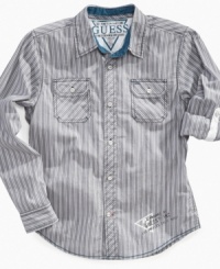 Casual goes classic with this sharp striped Guess shirt that will keep him comfortable through the school day. Casual goes classic with this sharp striped Guess shirt that will keep him comfortable through the school day.