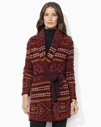 A soft knit sweater is designed in a heritage-inspired silhouette with a shawl collar and belted waist. A soft knit sweater is designed in a heritage-inspired silhouette with a shawl collar and belted waist.