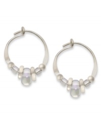 Prismatic shine. Jody Coyote's pretty hoop earrings feature iridescent Czech glass and silver accent beads, set in sterling silver. Approximate diameter: 1/2 inch. Prismatic shine. Jody Coyote's pretty hoop earrings feature iridescent Czech glass and silver accent beads, set in sterling silver. Approximate diameter: 1/2 inch.