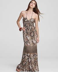 Go long and slither into this stunning maxi-length Sky dress--enriched with a chic snakeskin print and finished with a dramatic halter neckline, this dress takes wearable glamour to the hilt. Go long and slither into this stunning maxi-length Sky dress--enriched with a chic snakeskin print and finished with a dramatic halter neckline, this dress takes wearable glamour to the hilt.