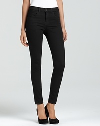 A high rise makes these super-skinny J Brand jeans the ideal companion to the season's sophisticated silk blouses--tucked in, of course. A high rise makes these super-skinny J Brand jeans the ideal companion to the season's sophisticated silk blouses--tucked in, of course.