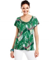 Warm up to summer in this Calvin Klein Jeans top, featuring a lush botanical-inspired print. Sequins at the neckline add an extra splash of flash! Warm up to summer in this Calvin Klein Jeans top, featuring a lush botanical-inspired print. Sequins at the neckline add an extra splash of flash!